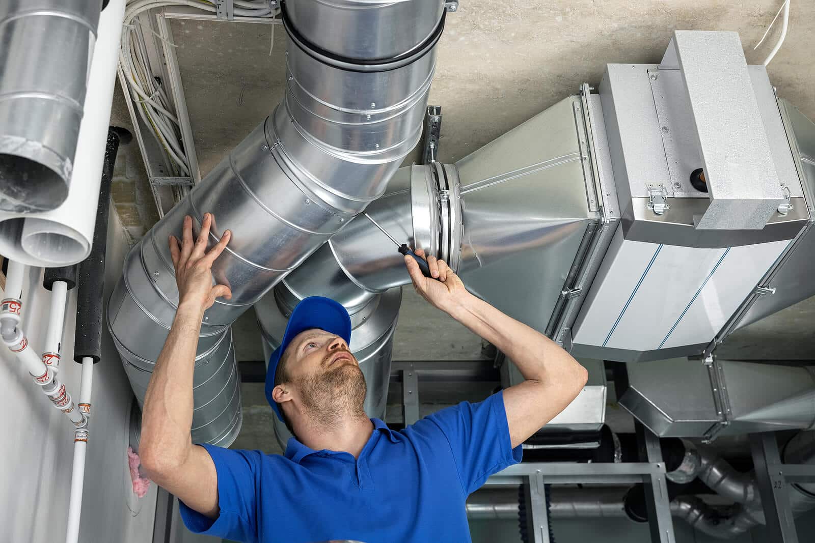 HVAC technician inspecting and repairing air ducts in Rocklin