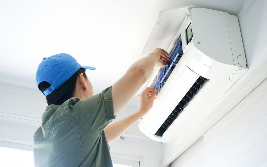 HVAC technician servicing a ductless mini split in Rocklin