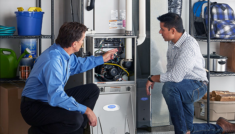 Technician evaluating a furnace for repair or replacement in Rocklin