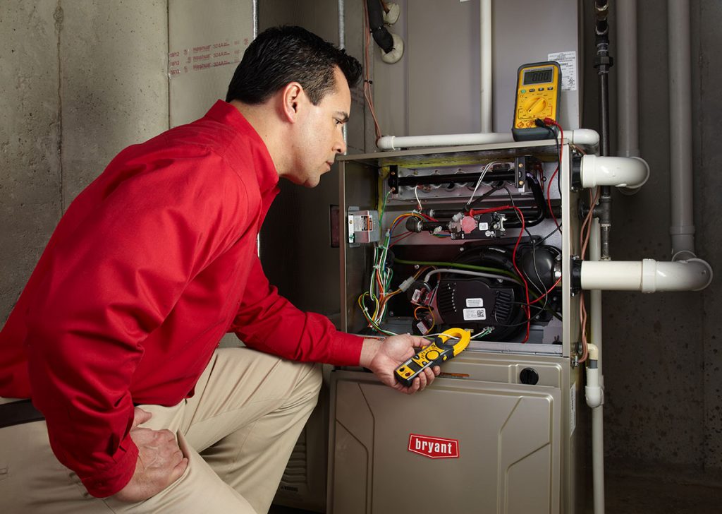 Heating technician diagnosing a furnace repair in Rocklin