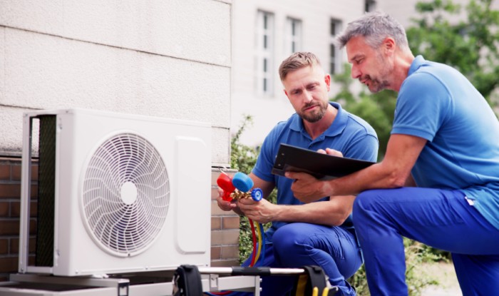 HVAC technicians installing an outdoor air conditioning unit in Rocklin