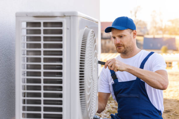 HVAC technician servicing an outdoor air conditioner in Rocklin