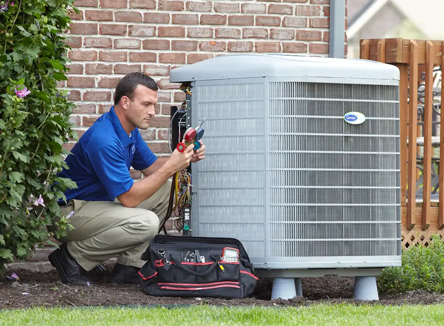HVAC technician inspecting an outdoor AC unit in Rocklin