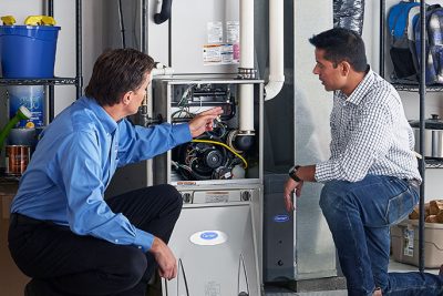 Furnace Repair or Replacement Rocklin Technician evaluating a furnace for repair or replacement in Rocklin