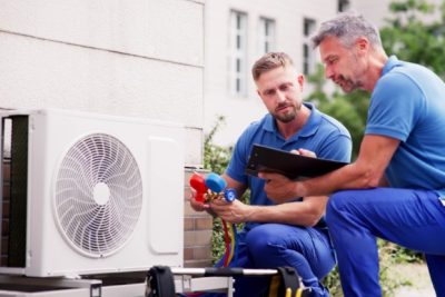 Outdoor AC Installation Rocklin HVAC technicians installing an outdoor air conditioning unit in Rocklin