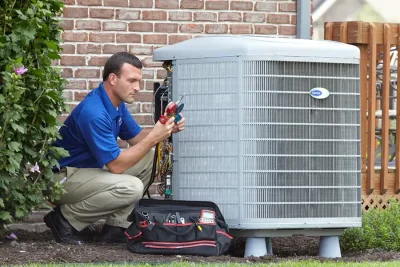 Outdoor AC Unit Inspection Rocklin HVAC technician inspecting an outdoor AC unit in Rocklin